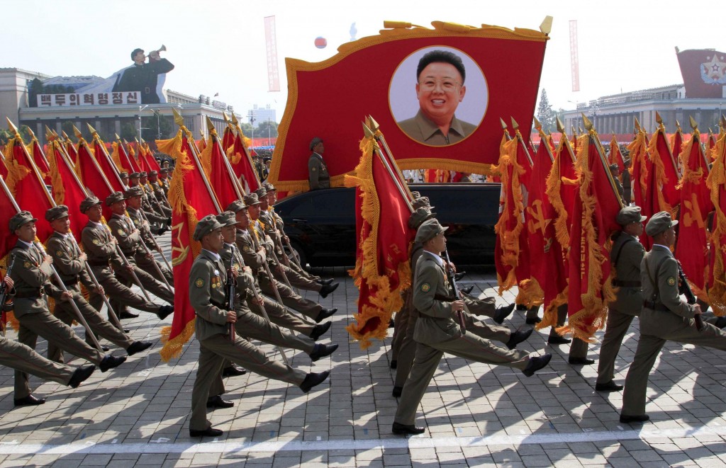 North Korean troops march past a portrait of the late leader Kim Jong Il during a military parade at Kim Il Sung Square to mark the 65th anniversary of the country's founding in Pyongyang, North Korea, Monday, Sept. 9, 2013. (AP Photo/Jon Chol Jin)